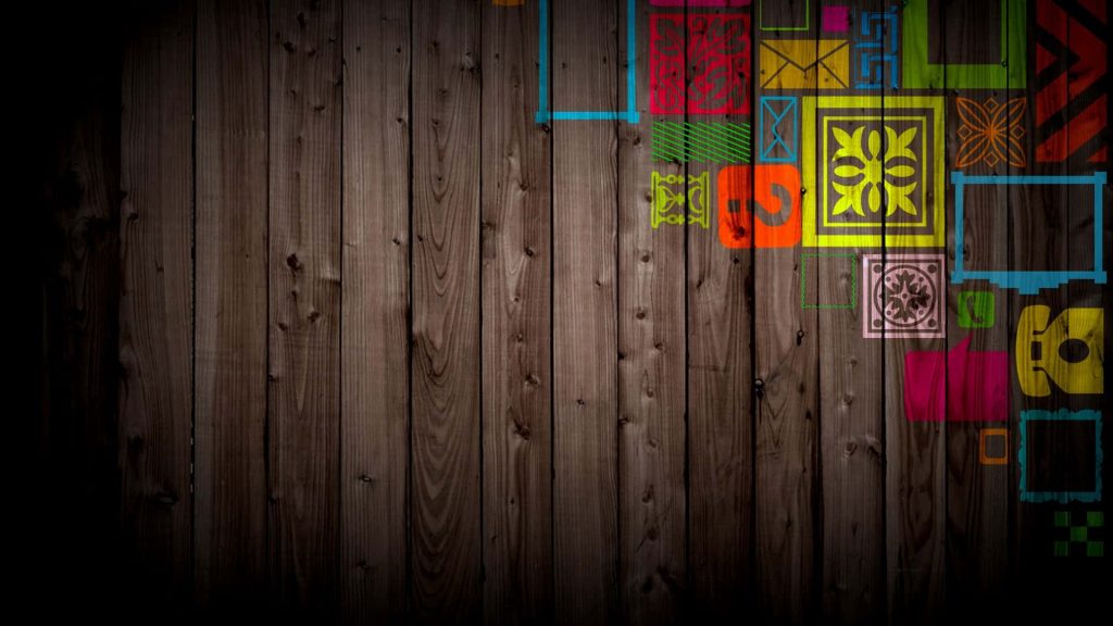 Rustic dark wood grain background with colorful geometric shapes and modern graphic icons on right Wallpaper