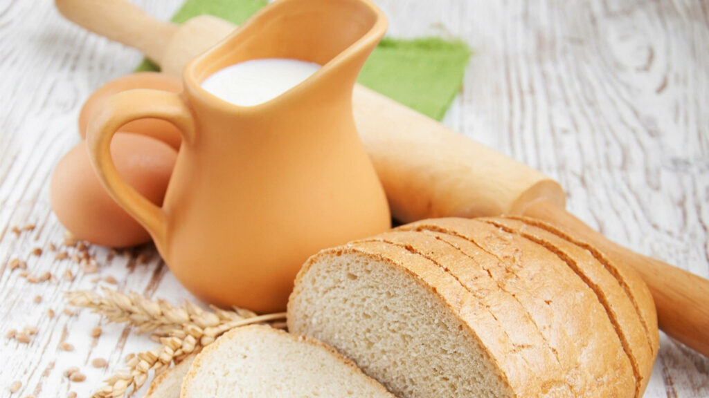 Rustic Food Photography Wallpaper: Freshly Sliced Bread & Milk Jug