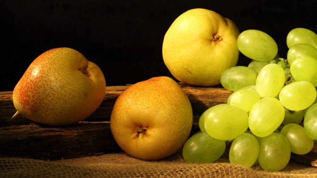 Rustic Wallpaper: Fresh Pears & Grapes on Wooden Surface