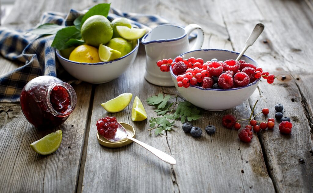 Rustic Fruit Wallpaper: Raspberries, Blueberries, and Jam on Wood
