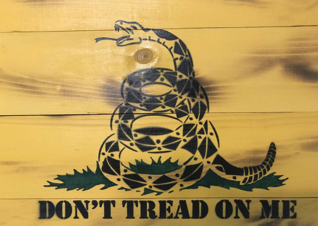 Gadsden Flag wallpaper with coiled rattlesnake and Dont Tread On Me on rustic yellow wood planks
