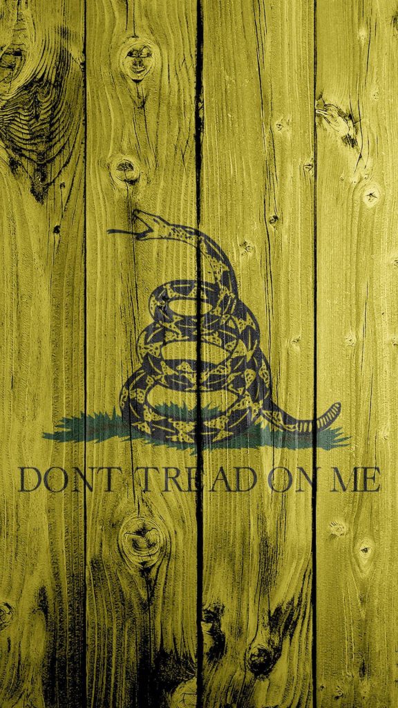 Rustic Gadsden Flag wallpaper with coiled rattlesnake and Dont Tread On Me slogan on wood background