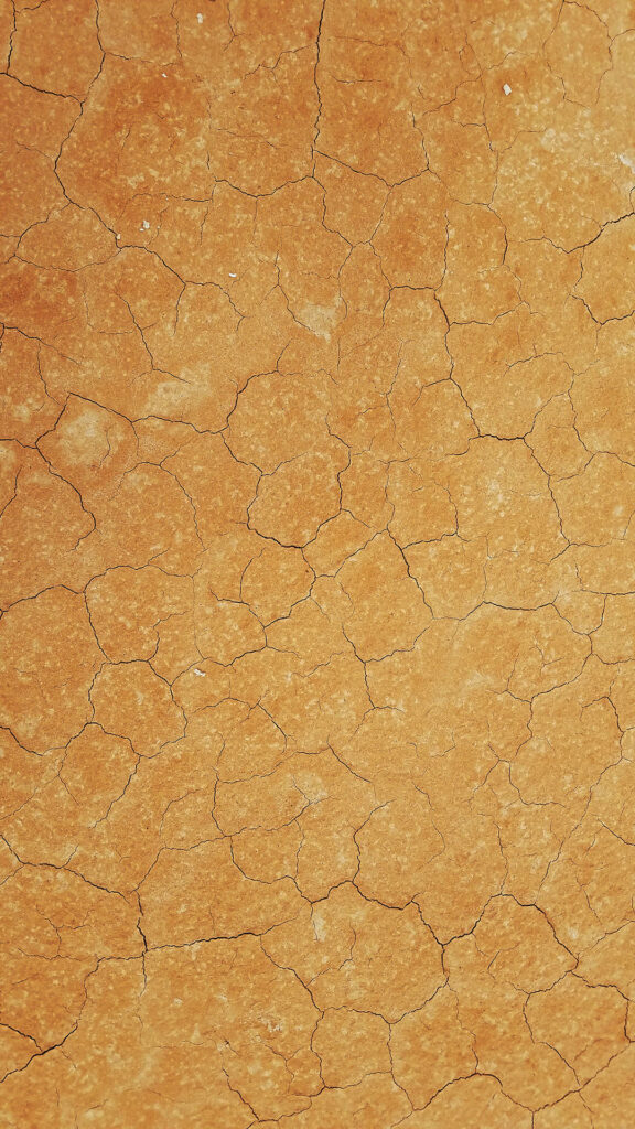 Rustic Elegance: Cracked Textured Gold Wallpaper Background