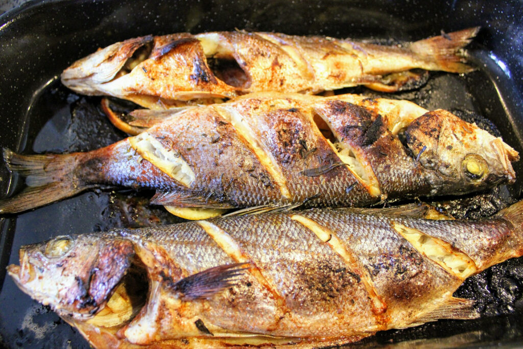 Rustic Grilled Sea Bass: Crispy Skin, Rich Flavors - Wallpaper Background