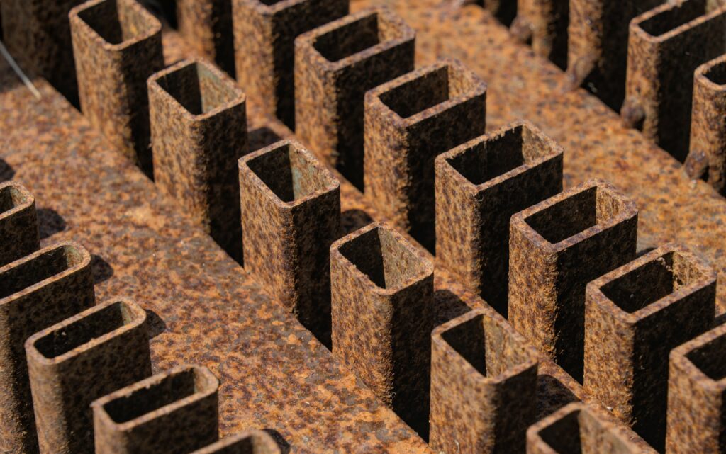 Macro Rusted Iron Wallpaper: Textured Geometric Pattern Background