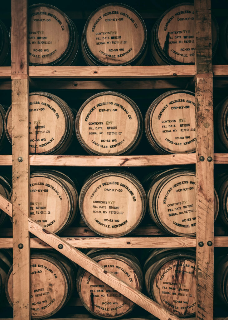 Rustic Wooden Barrels: Vintage Kentucky Distillery Wallpaper Background