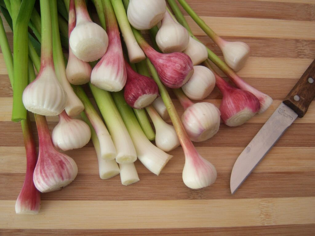 Rustic Kitchen Wallpaper: Wooden Cutting Board with Fresh Garlic & Knife