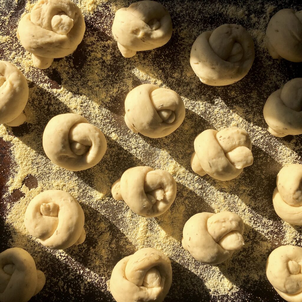 Rustic Wallpaper: Freshly Prepared Dough Knots on Floured Surface