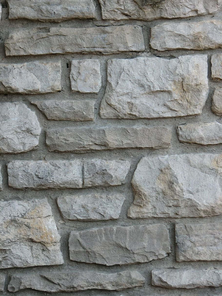 Rustic Masonry Stone Texture Wallpaper Background in Natural Tones