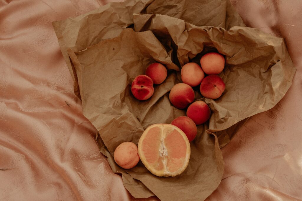 Rustic Nectarines & Orange on Crumpled Paper Wallpaper Background