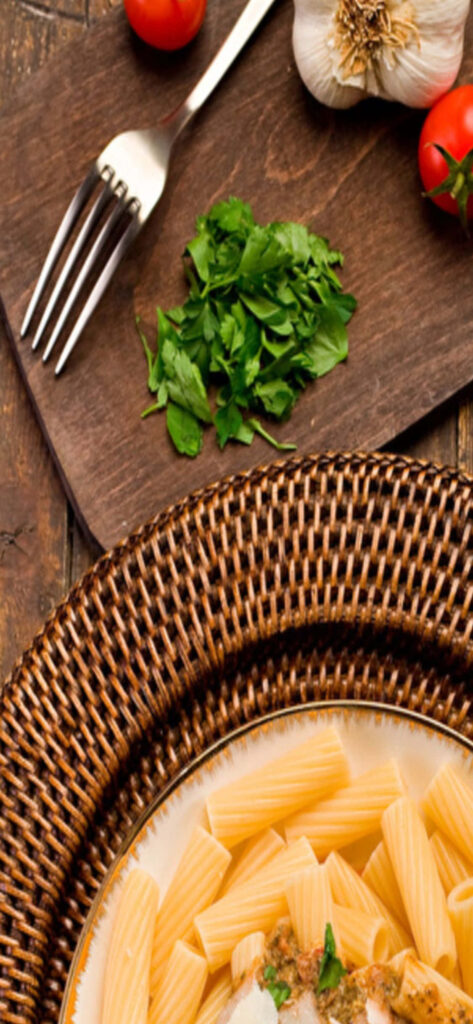 Rustic Rigatoni Pasta Close-Up with Garlic & Tomatoes - Wallpaper