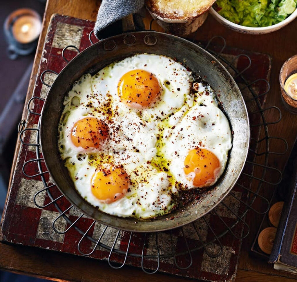 Rustic Skillet with Fried Eggs & Vibrant Yolk - Kitchen Wallpaper