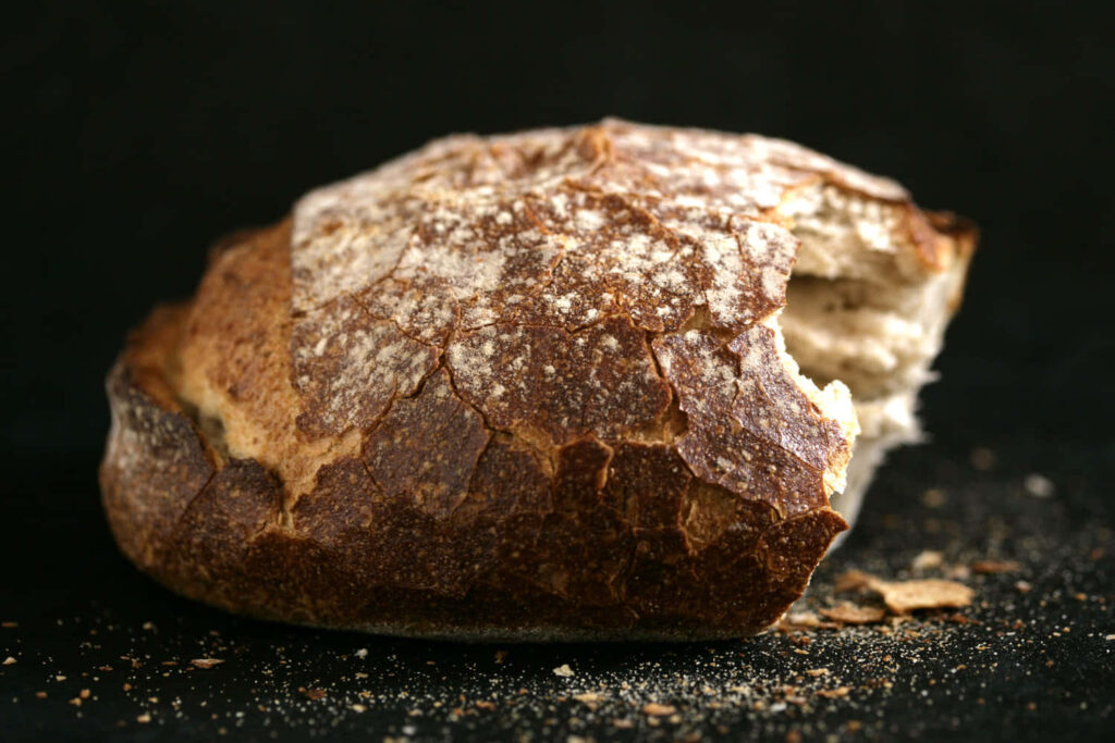 Rustic Crusty Sourdough Bread Close-Up Wallpaper Background