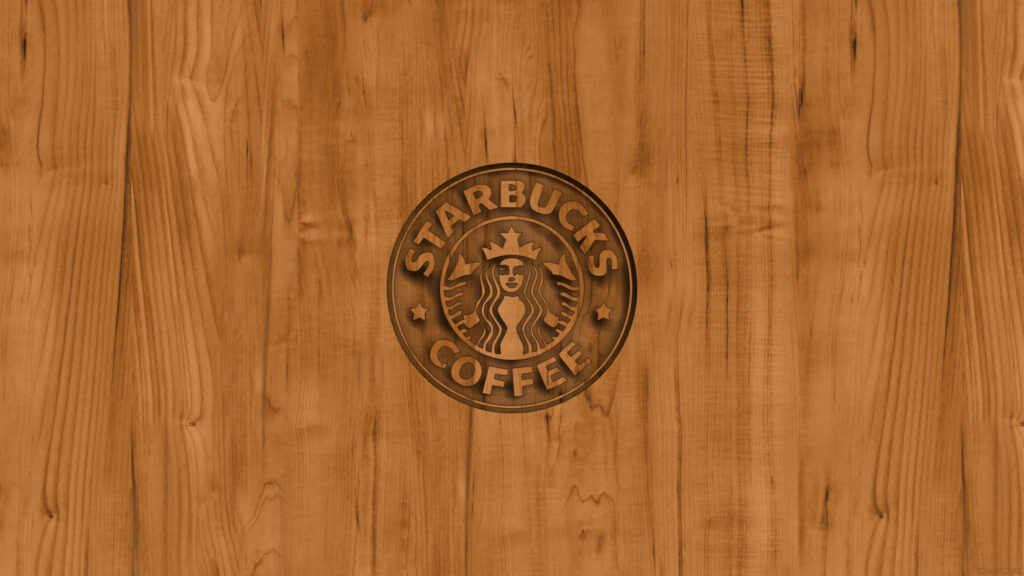Starbucks logo engraved on textured rustic wooden background cozy coffee wallpaper