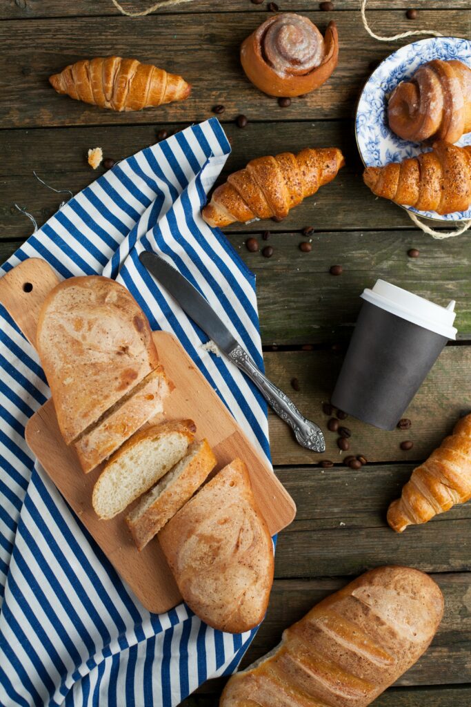 Rustic Still Life: Fresh Bread, Croissants & Coffee Wallpaper