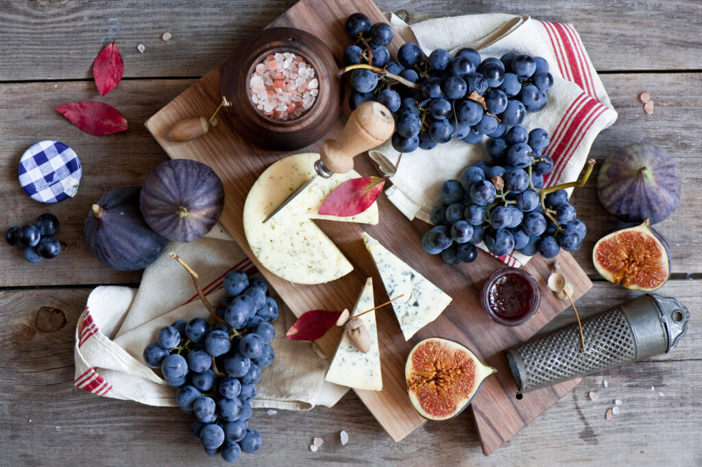 Rustic Still Life Wallpaper: Figs, Grapes, Cheese & Elegance