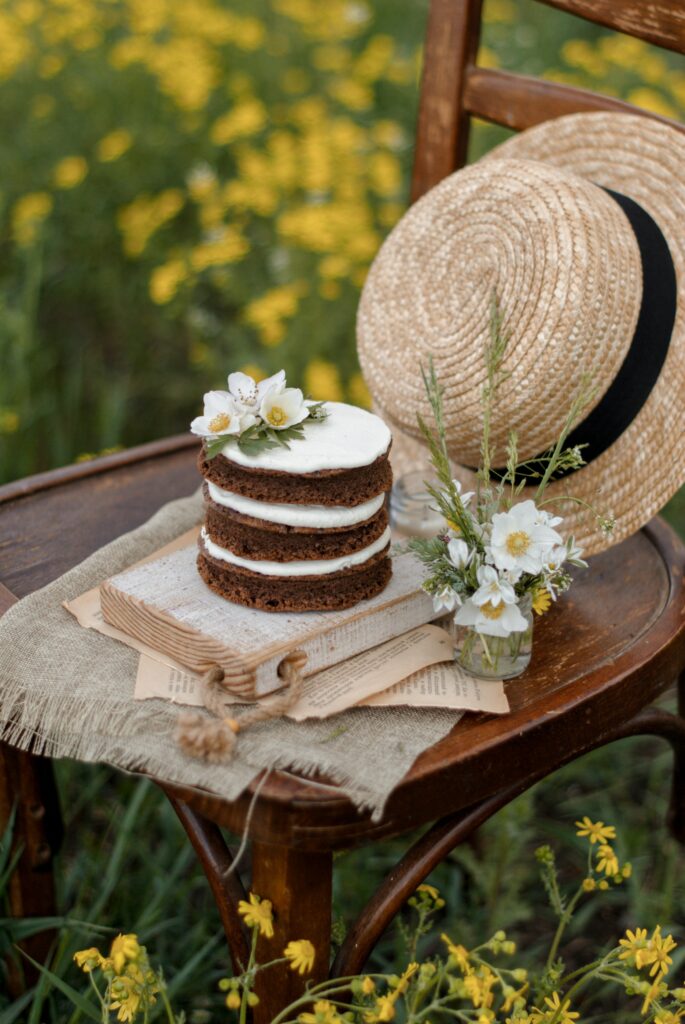 Rustic Still Life Wallpaper: Layered Cake & Jasmine Flowers Outdoors