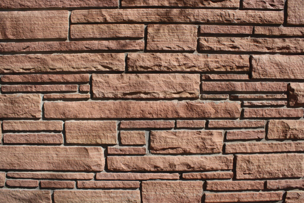 Rustic Stone Brick Wallpaper: Warm Earthy Tones & Texture