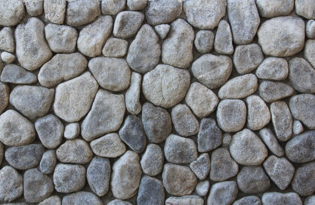 Rustic Stone Wall Texture Wallpaper: Earthy & Naturally Shaped Rocks