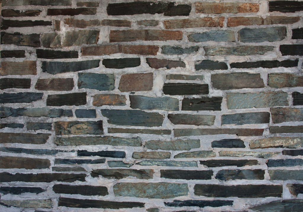 Rustic Stone Wall Wallpaper: Earthy Tones & Textured Background