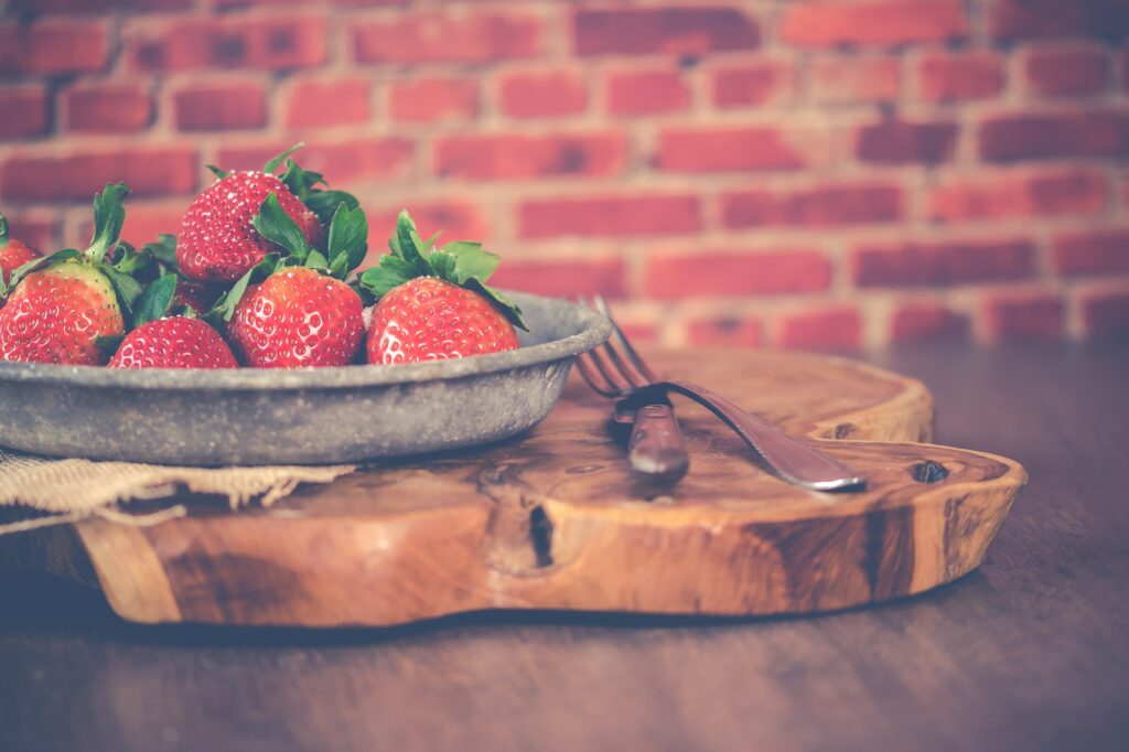 Rustic Strawberry Wallpaper: Fresh Fruits on Wooden Surface