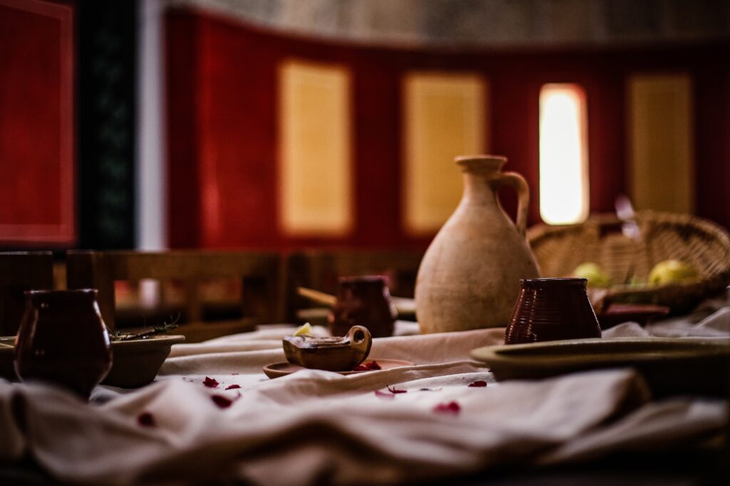 Inviting Rustic Table Setting with Clay Dishes - Warm Wallpaper Background