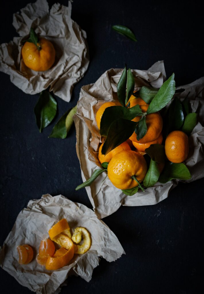 Vibrant Rustic Tangerine Wallpaper with Fresh Leaves and Zest