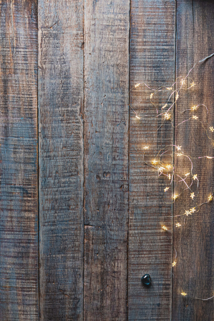 Rustic Wooden Background with Warm Decorative Lights Wallpaper