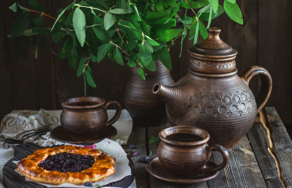 Rustic Wallpaper: Cozy Tea Party with Ceramic Kettle & Pastry