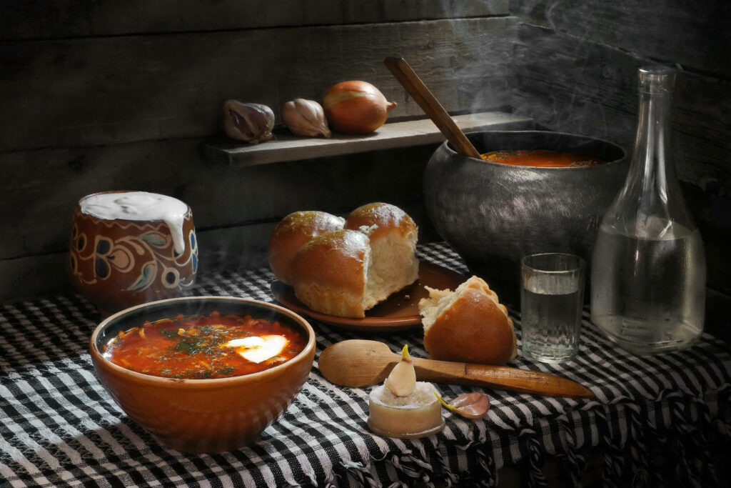 Cozy Rustic Wallpaper with Vibrant Borscht and Pastries Setup