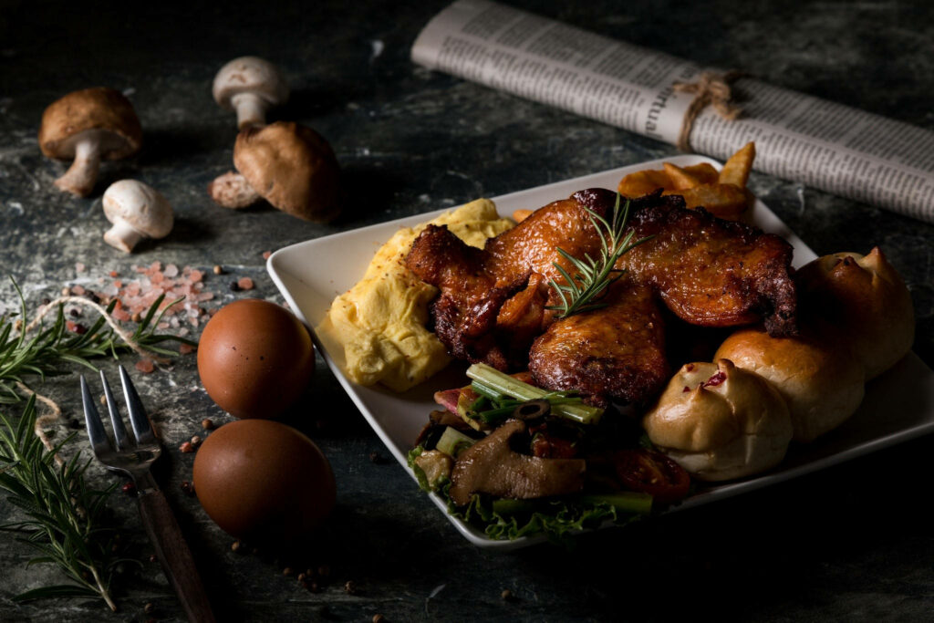 Rustic Roasted Chicken Wallpaper: Savory Dish on Dark Background