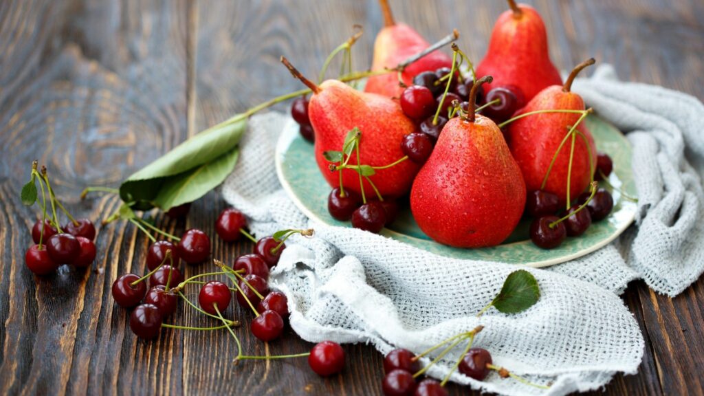 Vibrant Wallpaper: Fresh Red Pears & Cherries on Rustic Table
