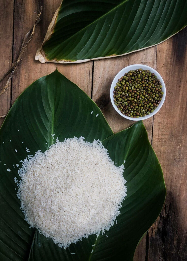 Rustic Wallpaper: White Rice on Green Leaf with Mung Beans