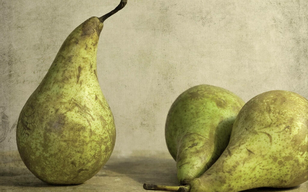 Rustic Wallpaper: Fresh Green Pears on Textured Earthy Background