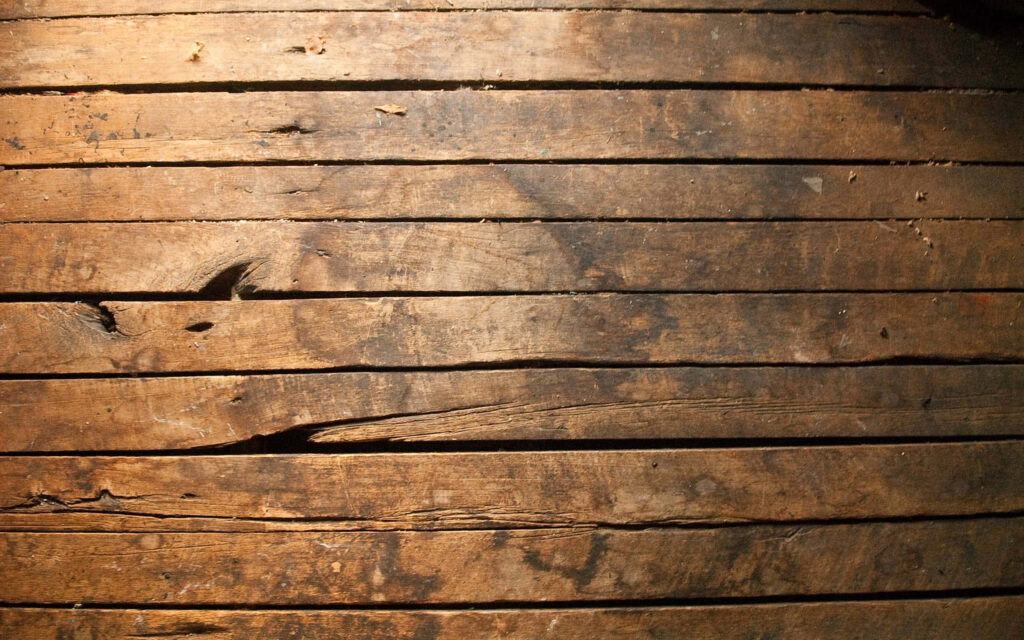 Rustic Wallpaper: Weathered Wooden Floorboards with Aged Charm