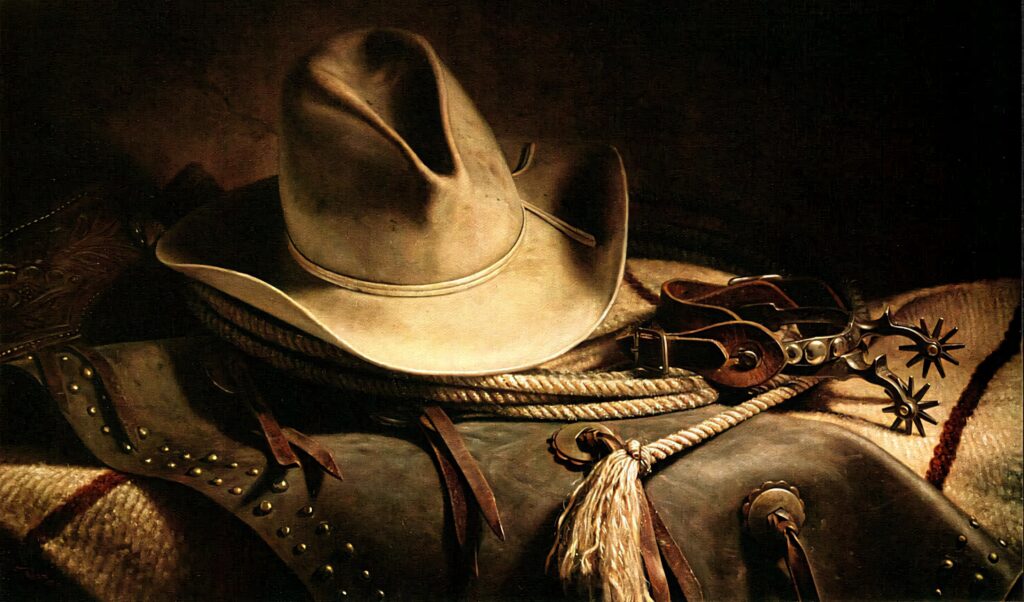 Classic Western cowboy gear wallpaper with hat saddle rope spurs in rustic warm backdrop