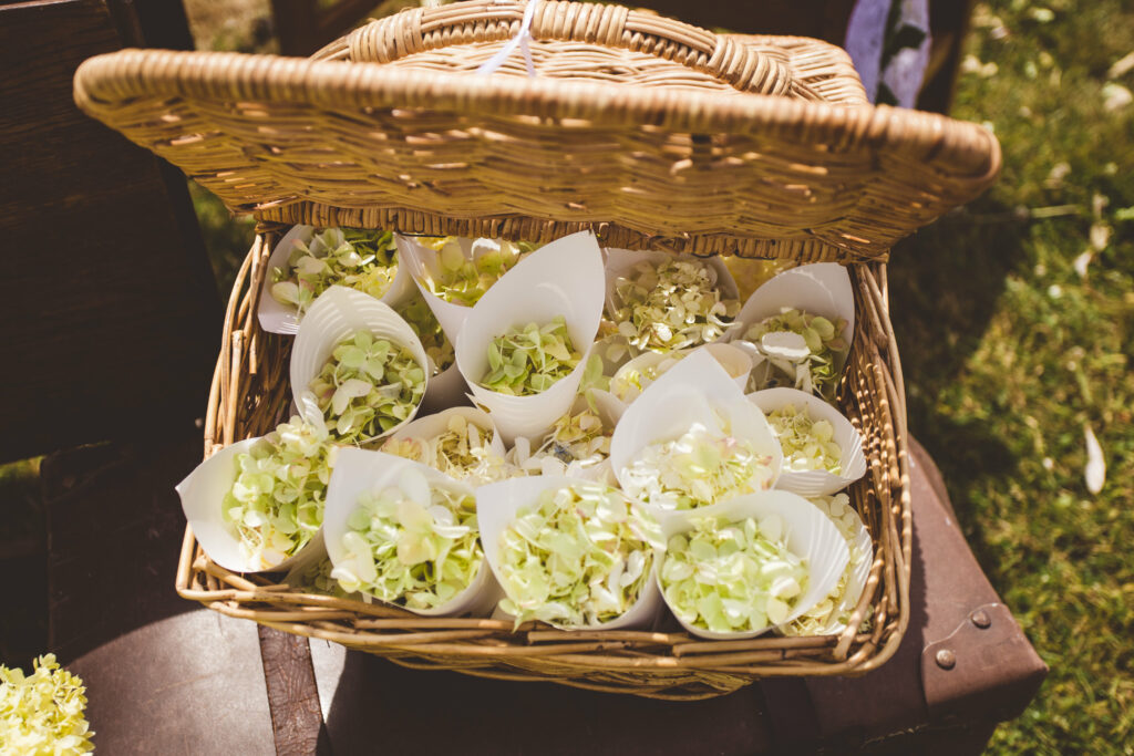 Rustic Wicker Basket with Pale Green and Cream Bouquet Wallpaper