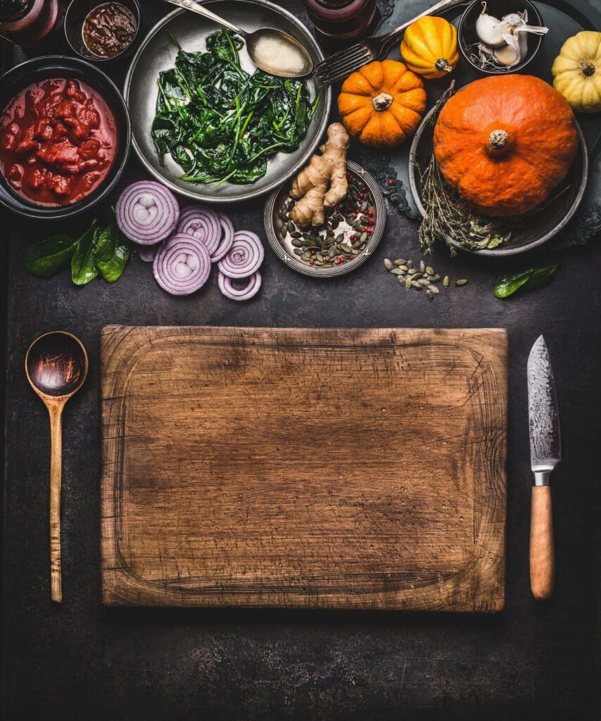 Rustic Winter Feast Prep: Fresh Ingredients on Wooden Cutting Board Wallpaper