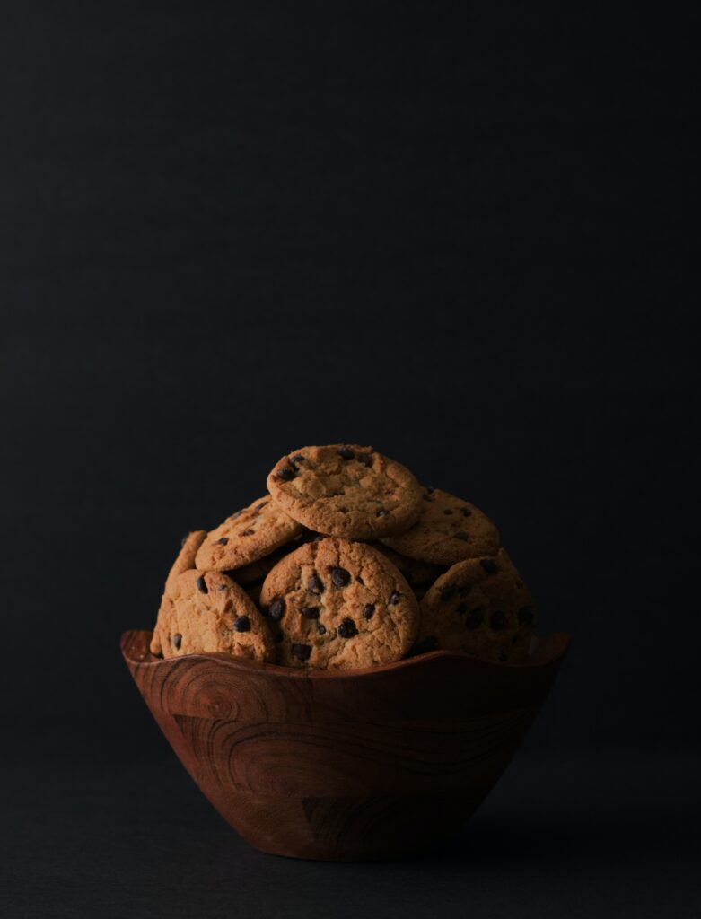 Rustic Bowl of Freshly Baked Chocolate Chip Cookies Wallpaper