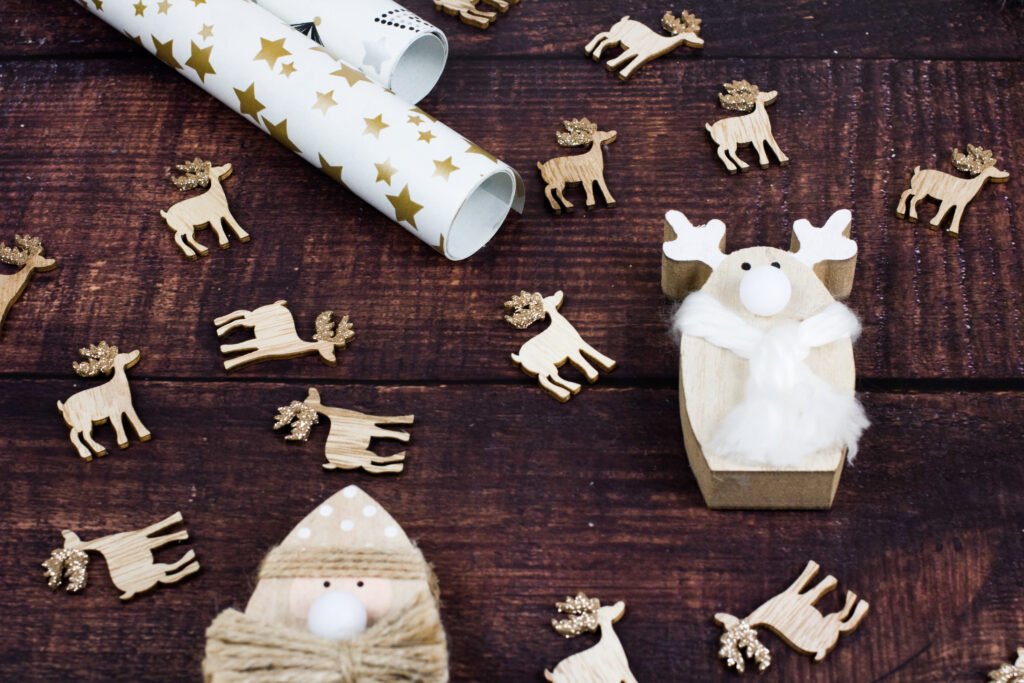 Rustic Wooden Background with Festive Deer & Christmas Decor Wallpaper