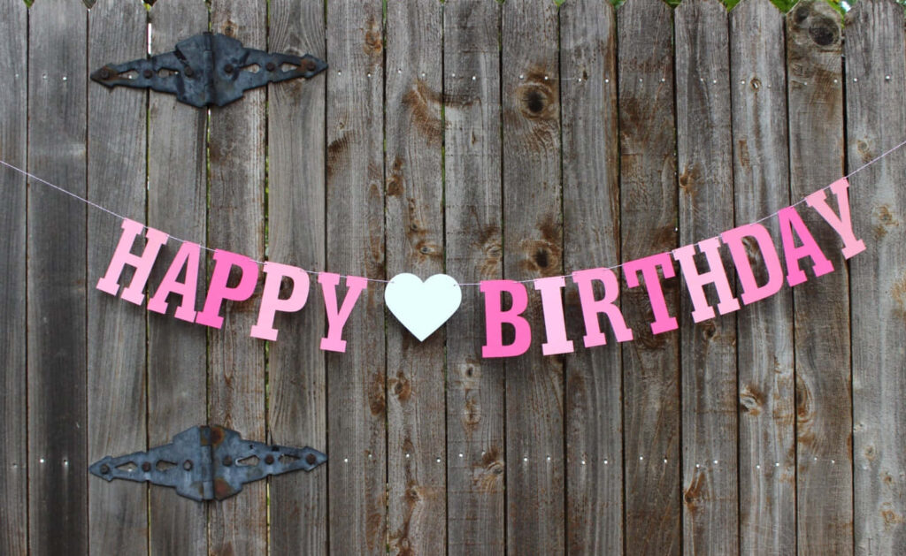 Rustic Fence with Simple Pink Happy Birthday Banner Background Wallpaper
