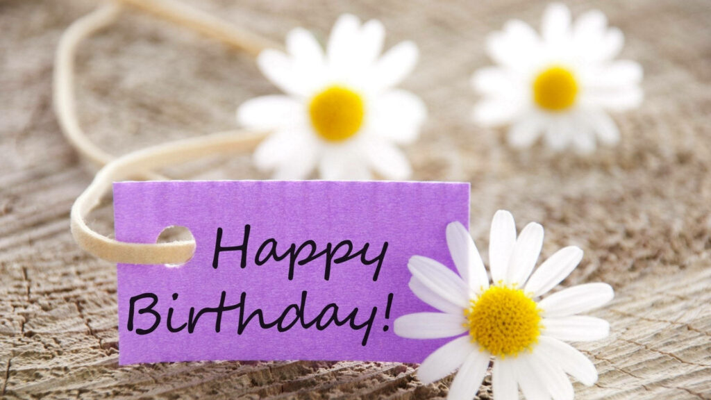 Rustic Wooden Background with Happy Birthday Tag & Daisies Wallpaper