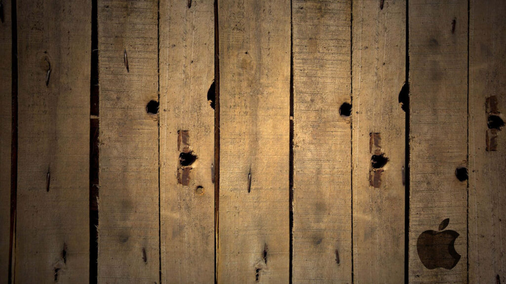 Rustic Wooden Plank Background with Subtle Apple Logo Wallpaper