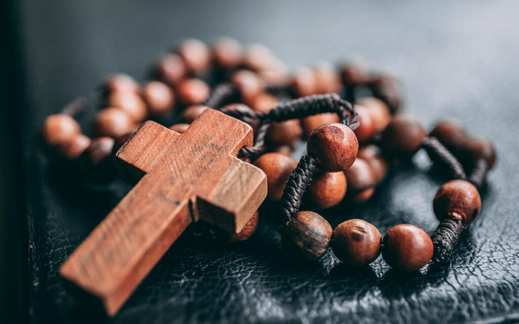 Rustic Wooden Rosary Beads on Dark Background - Catholic Faith Wallpaper
