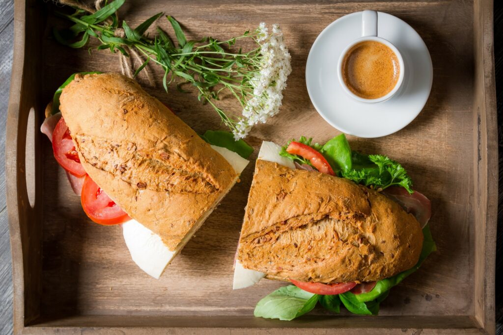 Rustic Wooden Tray with Fresh Sandwiches & Coffee Wallpaper