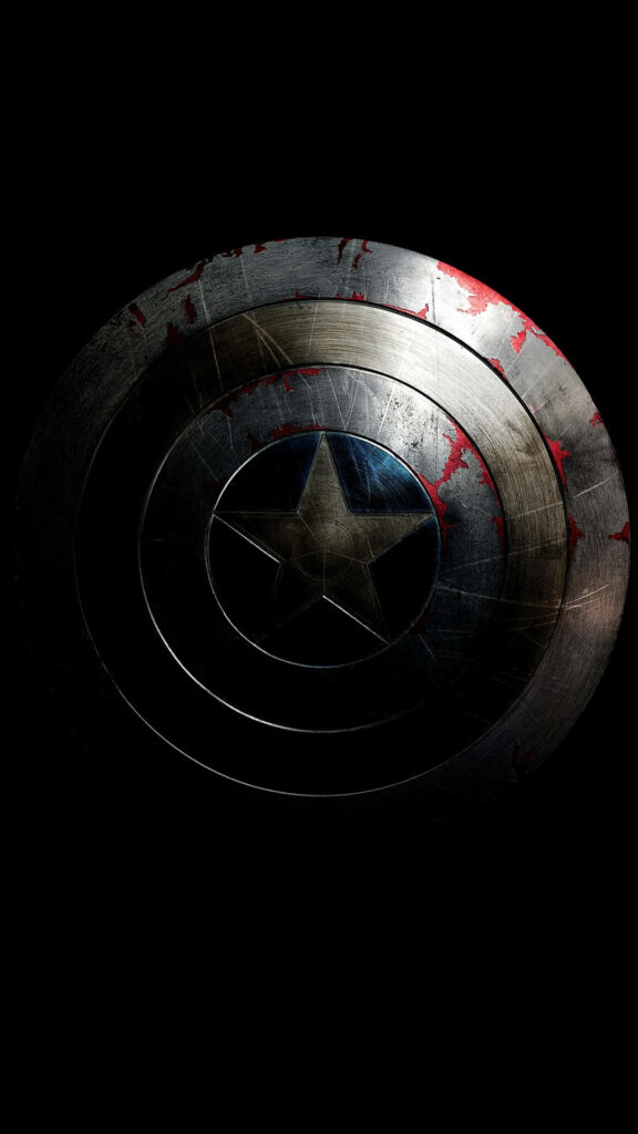 A Weathered Captain America Shield Embodied in Darkness Wallpaper