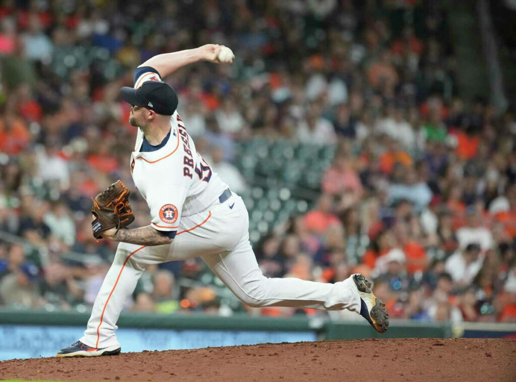 Intense Ryan Pressly Pitching Wallpaper: Focused Baseball Action