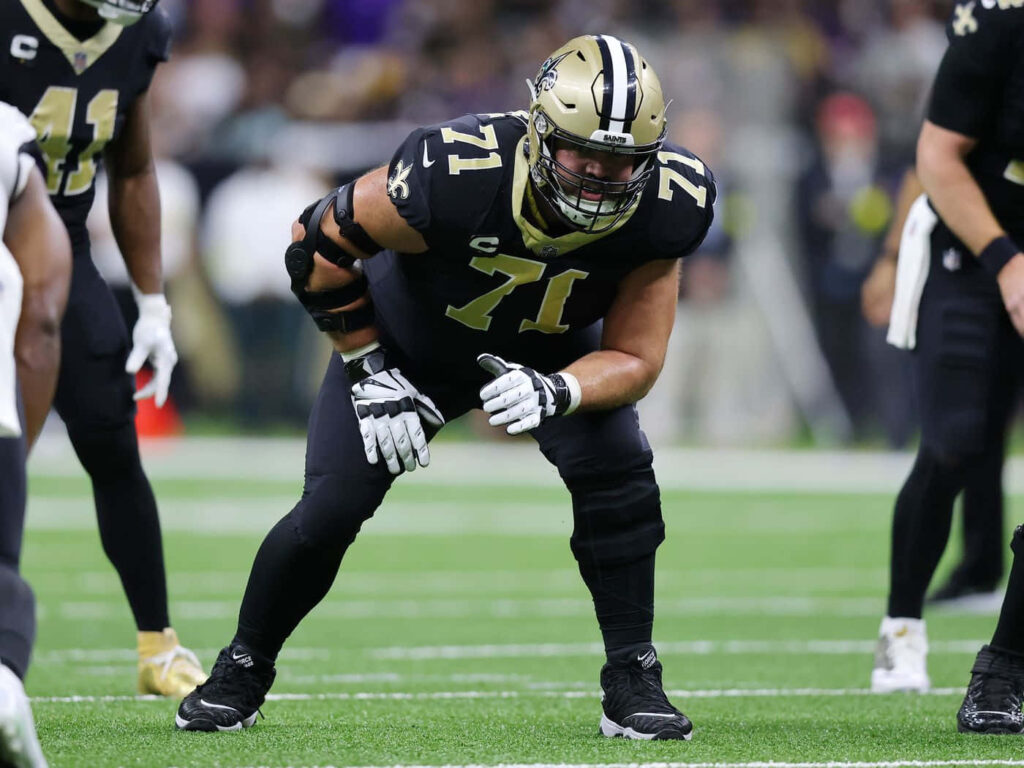 Ryan Ramczyk football action blocking Baltimore Ravens intense focus dynamic wallpaper background