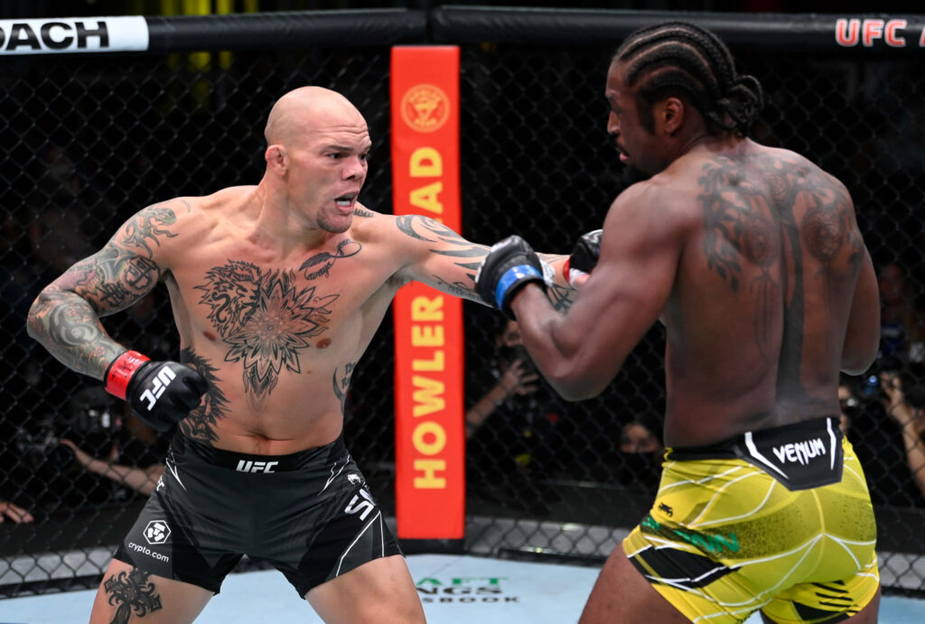 Ryan Spann and Anthony Smith UFC fight intense moment showing tattoos and muscular physiques Wallpaper