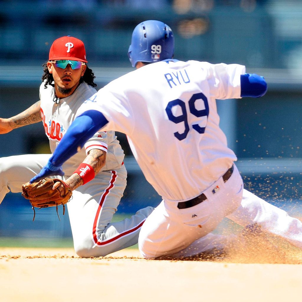 Ryu Hyun-jin sliding into base in Dodgers uniform versus Phillies infielder intense MLB action Wallpaper